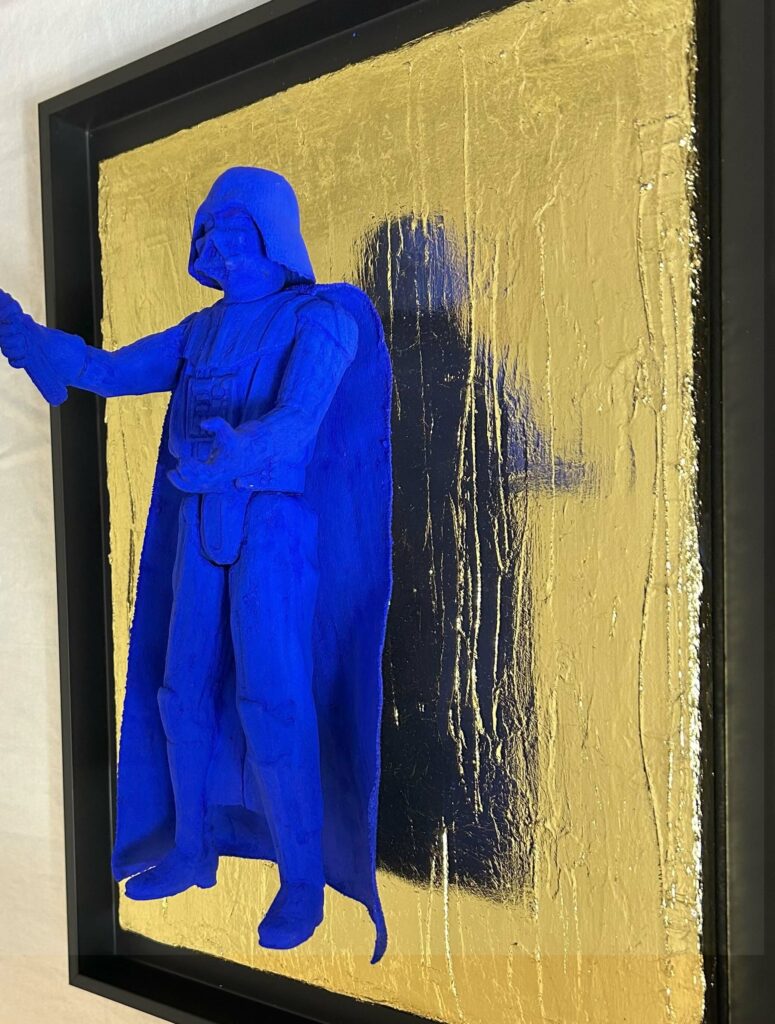 Seb Machten Contemporary pop art sculpture of a blue armored dark figure with red light sword on gold textured background, inspired by iconic sci-fi villain archetypes