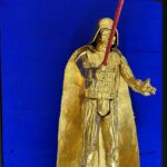 Seb Machten Contemporary pop art sculpture of a gold armored dark figure with red light sword on deep blue background, inspired by iconic sci-fi villain archetypes