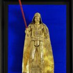 Seb Machten Contemporary pop art sculpture of a gold armored dark figure with red light sword on deep blue background, inspired by iconic sci-fi villain archetypes