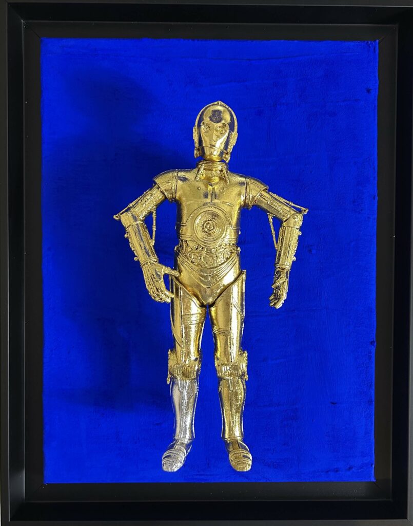 Seb Machten contemporary artwork with gold humanoid robot inspired by C-3PO on deep ultramarine background