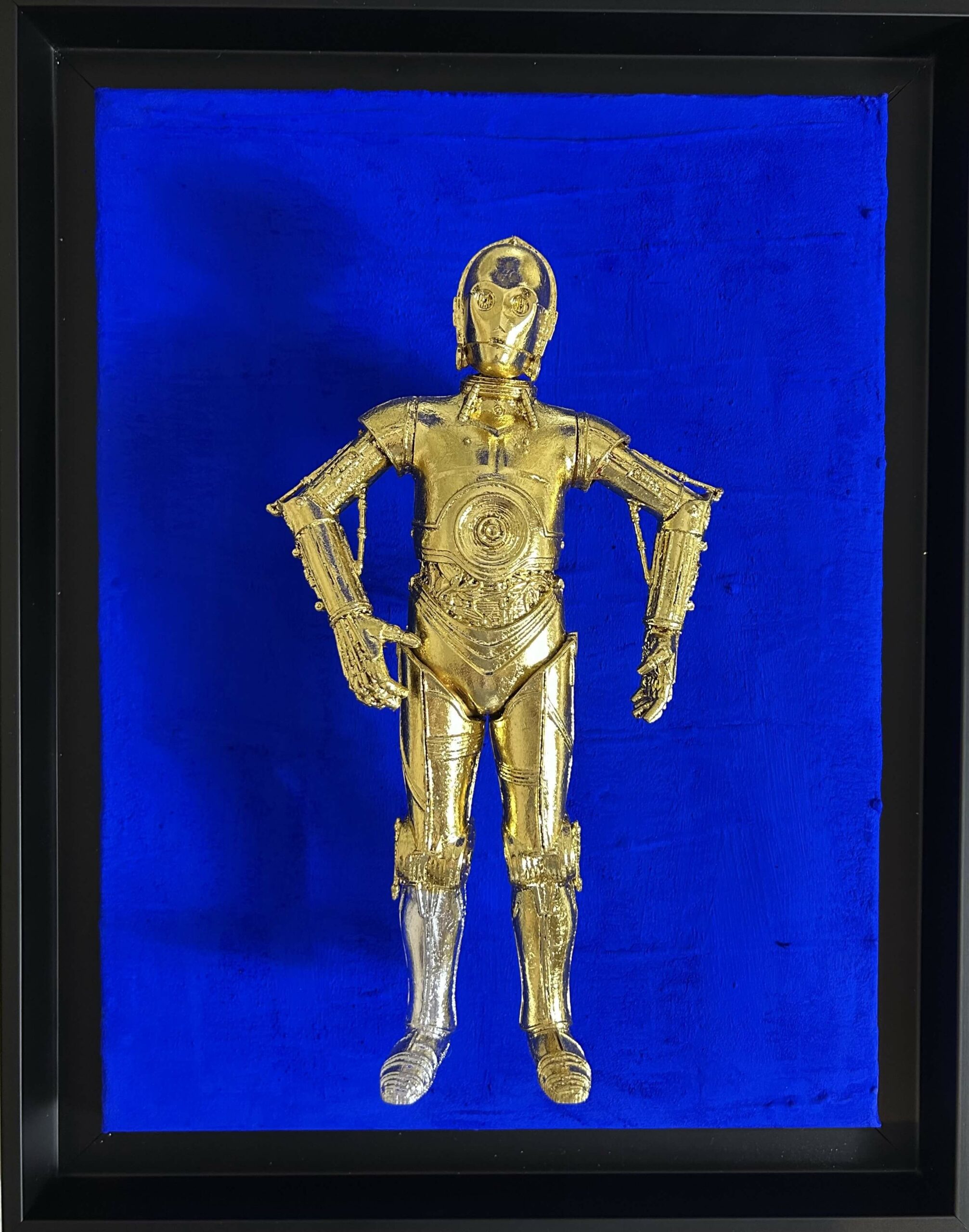 Seb Machten contemporary artwork with gold humanoid robot inspired by C-3PO on deep ultramarine background