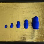 Seb Machten contemporary artwork with blue matryoshka figures arranged in progression on textured gold leaf surface background