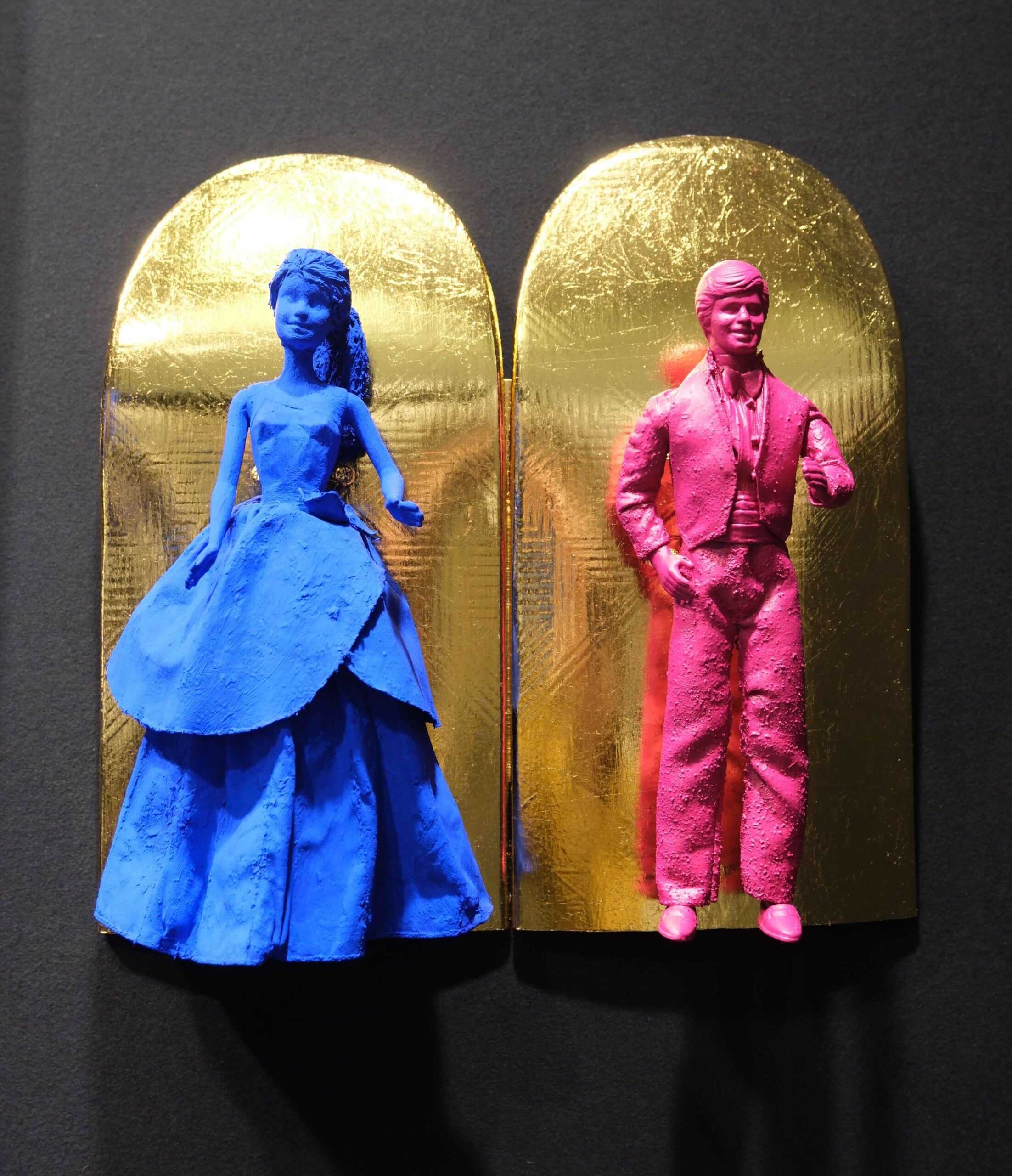 Seb Machten contemporary artwork with blue and pink doll figures on gold leaf skateboards