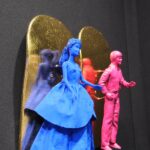 Seb Machten contemporary artwork with blue and pink doll figures on gold leaf skateboards