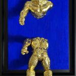 Seb Machten contemporary artwork with fragmented golden hero figure on deep ultramarine surface