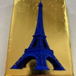 Seb Machten contemporary artwork with ultramarine Eiffel Tower sculpture on gold leaf surface