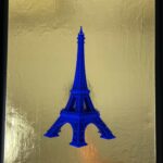 Seb Machten contemporary artwork with ultramarine Eiffel Tower sculpture on gold leaf surface
