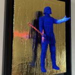 Seb Machten contemporary artwork with ultramarine Kylo Ren inspired figure and red lightsaber on gold leaf surface