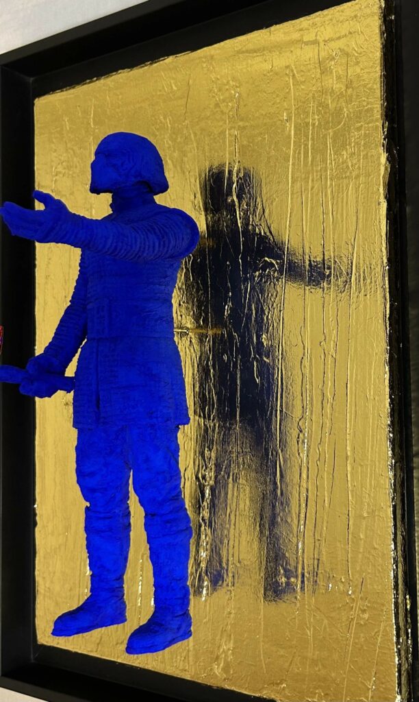 Seb Machten contemporary artwork with ultramarine Kylo Ren inspired figure and red lightsaber on gold leaf surface