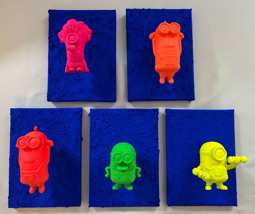 Seb Machten contemporary pop art sculpture with fluorescent orange minion-inspired figure on ultramarine textured surface